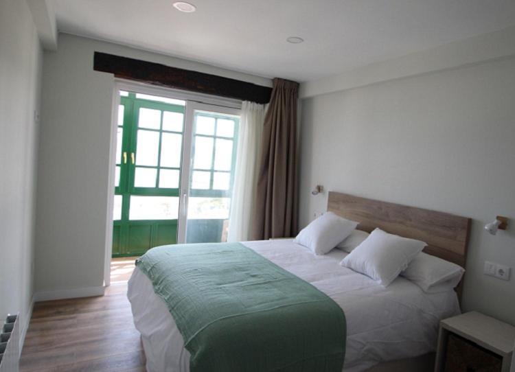 Apartamentos El Muelle Comillas Esterno foto